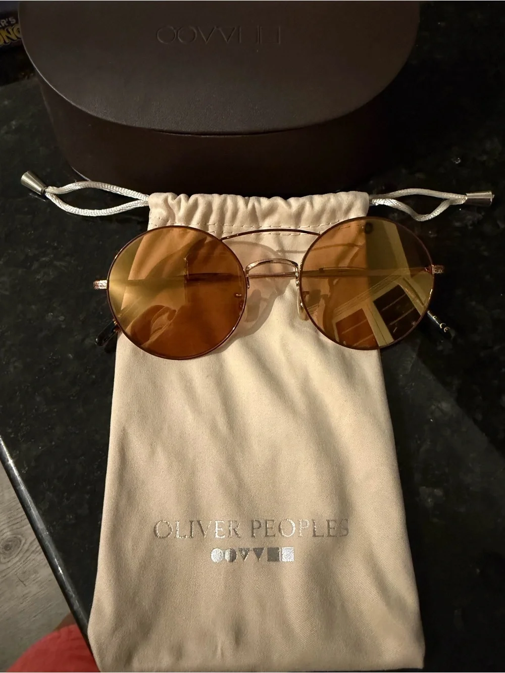Oliver Peoples Round Metal Sunglasses with Amber Brown Lenses
